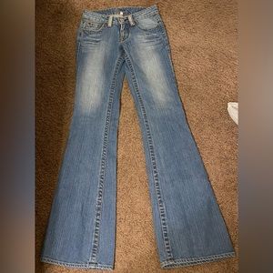 Bebe rhinestone logo flare jeans.